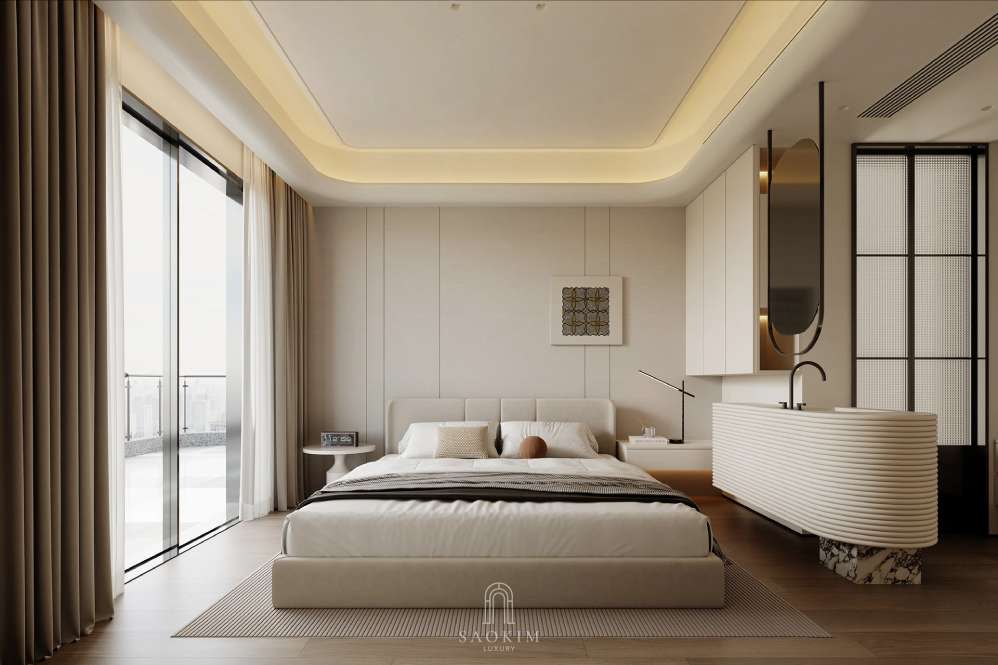 Phòng ngủ mang phong cách Quiet Luxury với gam màu be nhẹ nhàng, chất liệu vải mềm mại và nội thất tối giản.